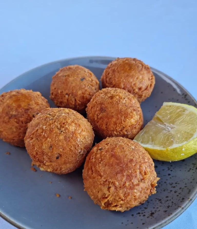 a plate of food with a lemon wedged in it