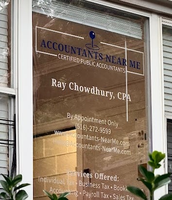 a business sign on a window of a businessr