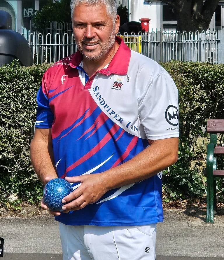 Porthcawl lawn bowls player in club shirt
