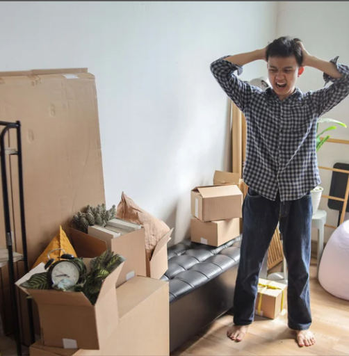 stressed during move with unpacked boxes needing organized