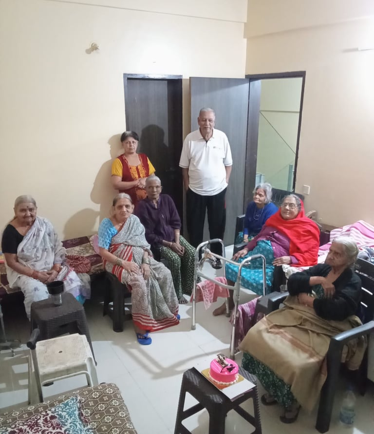 Seniors watching television in an Old Age Home in Pune