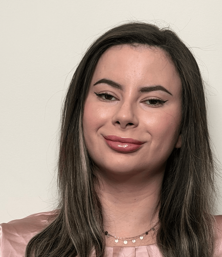 Hands holding a warm cup of tea, representing calm support and emotional grounding.