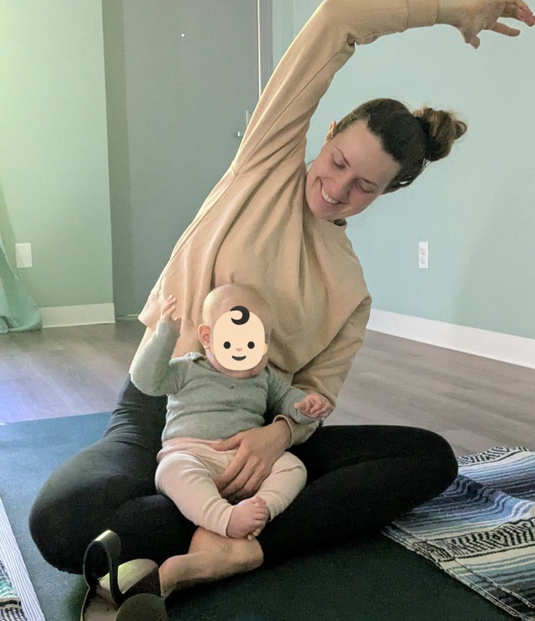 A mother and her infant stretching together