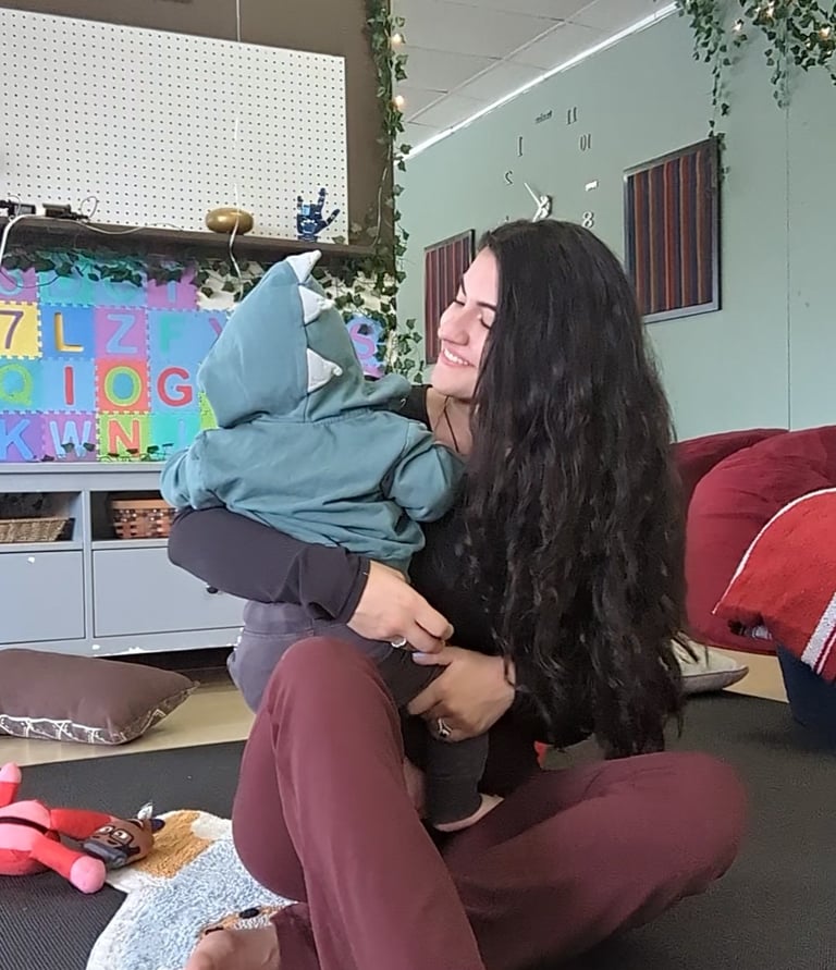 a mother and her child doing yoga together.