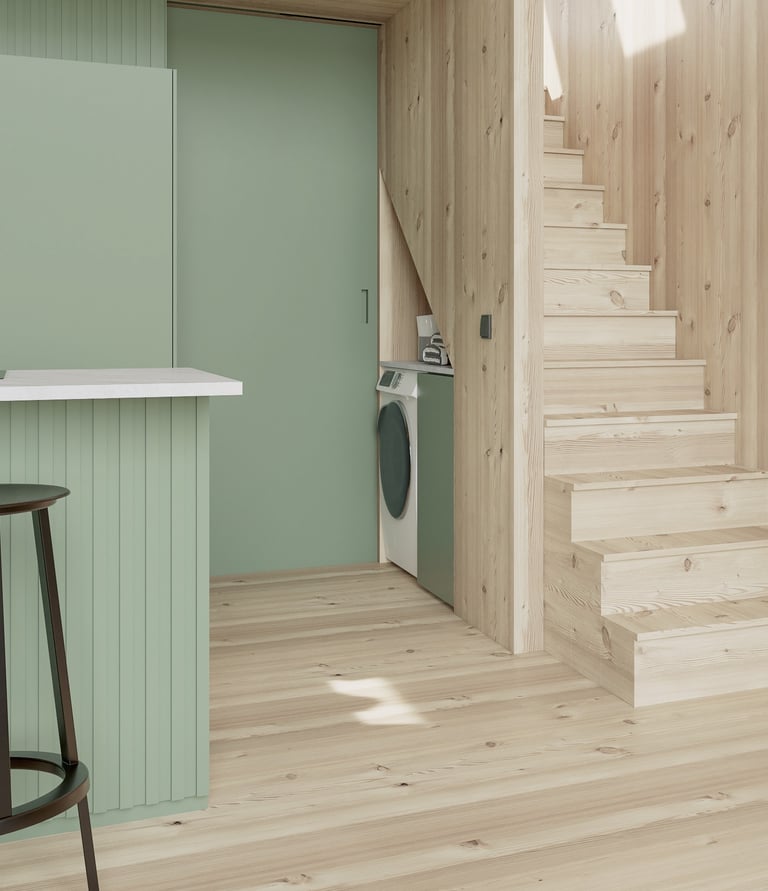 a kitchen with a washing machine and a washing machine