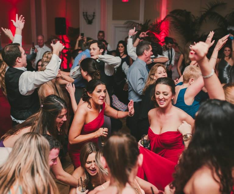 a group of people dancing at a party
