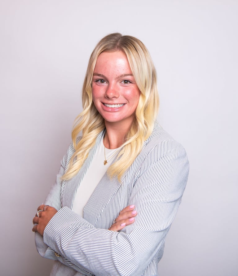 Headshot of Whitney showcasing a friendly, approachable expression.