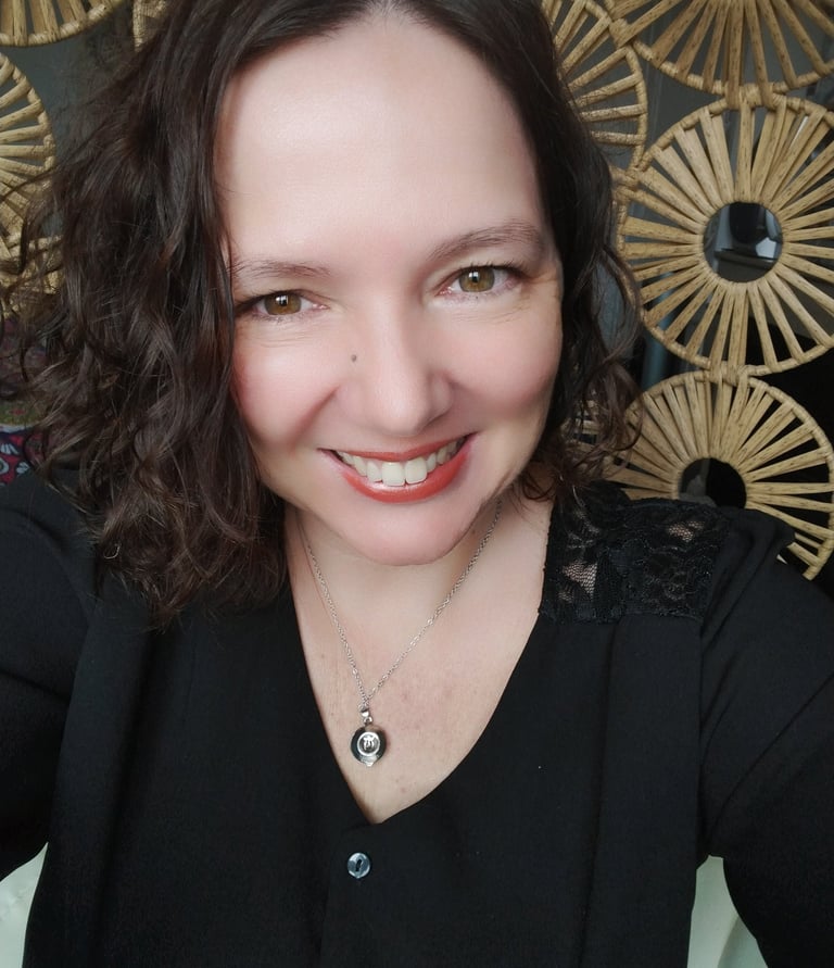 a woman with a necklace and a necklace with a pendant