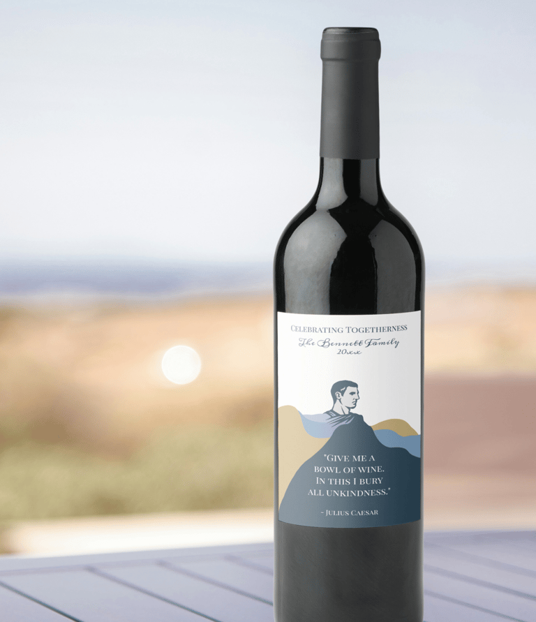 A sleek wine bottle with a custom label featuring a minimalist portrait and a Shakespeare quote.