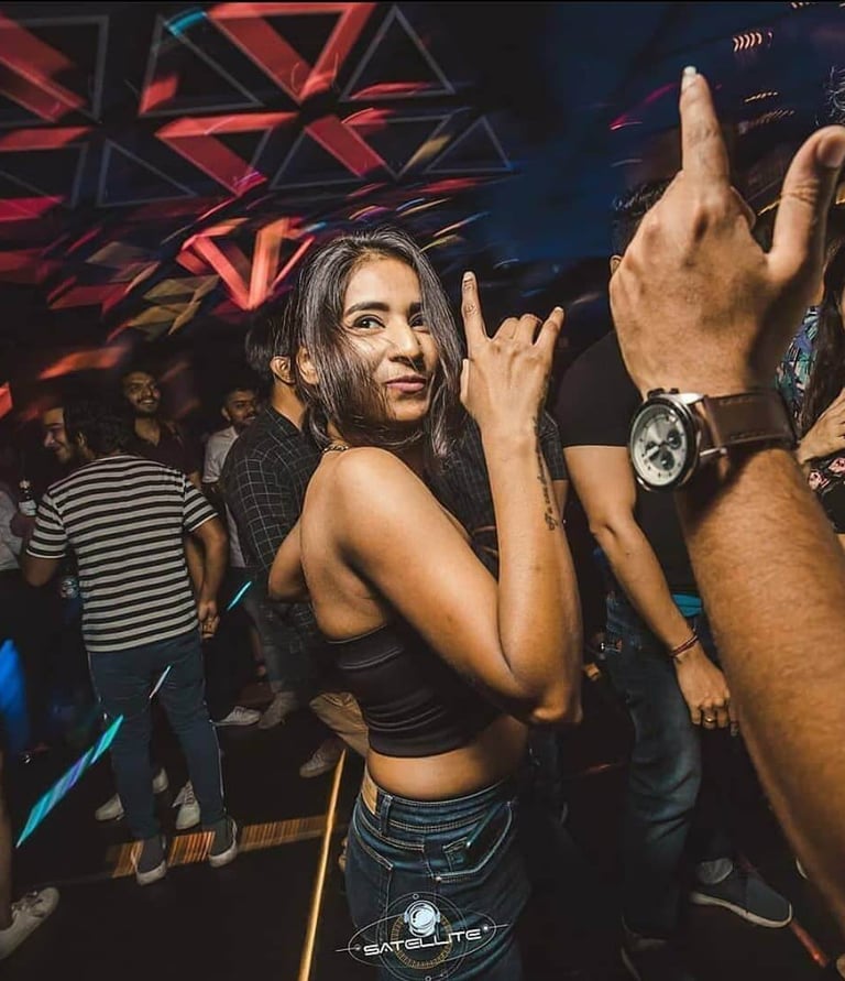 a woman in a black top and jeans jeans and a watch