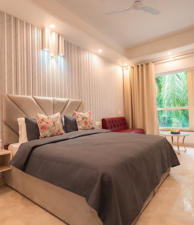 a bedroom with a bed and a couch