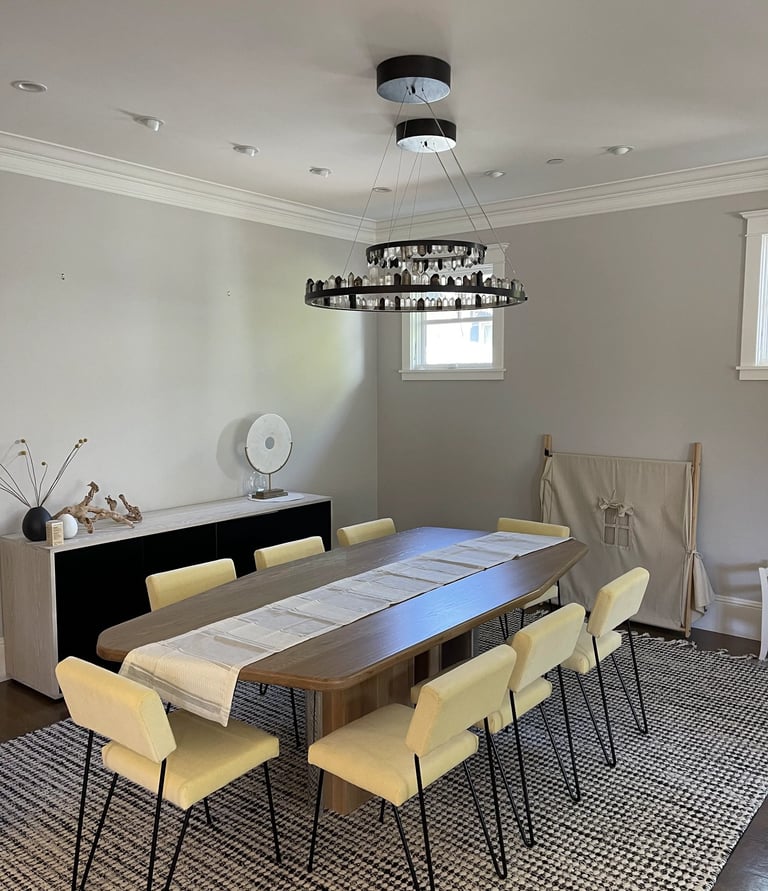 a dining room table with chairs and a table