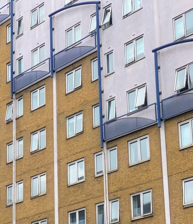 Block of flats with white and gold painting