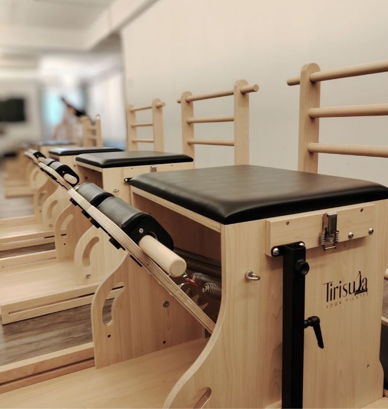 Pilates Wunda Chair and Ladder-Barrel convertible equipment. Tirisula Pilates