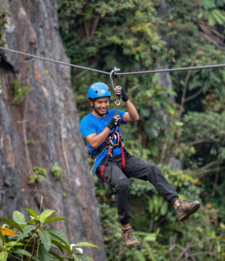 A scenic view of the resort nestled in lush greenery with ATV tracks winding through nature.
