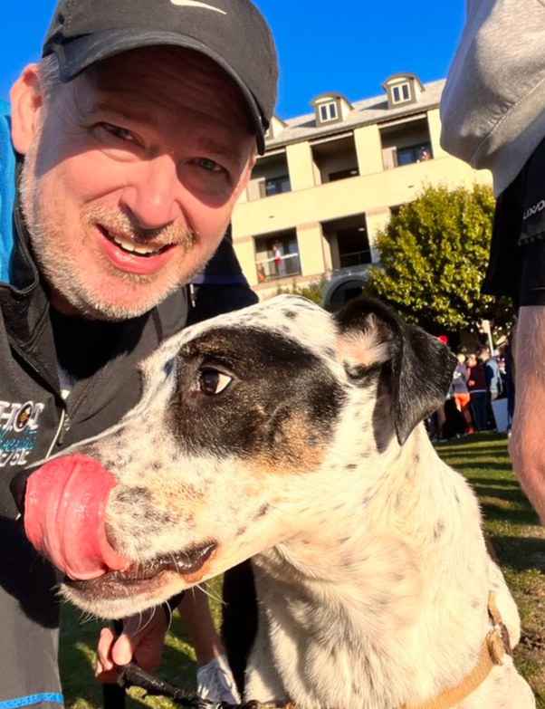 Carter Cathey original photo of Carter and dog Scout after a 5k.