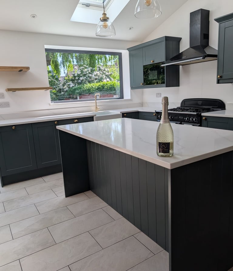 Clean modern kitchen with a bottle of champagne on the counter top