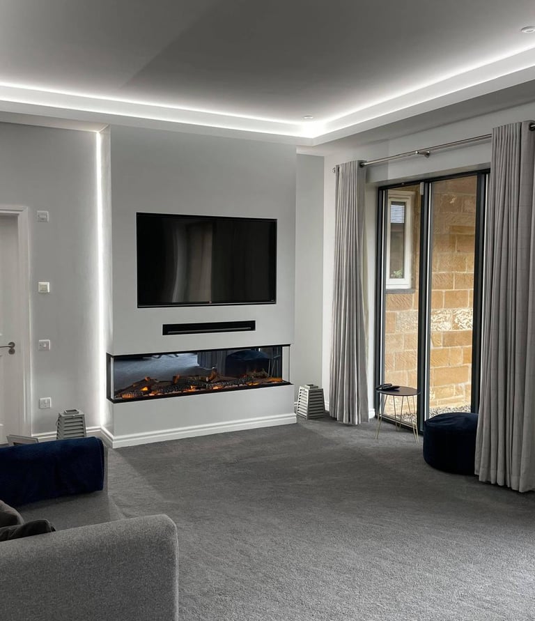 Sleek media wall in living room with bespoke lighting