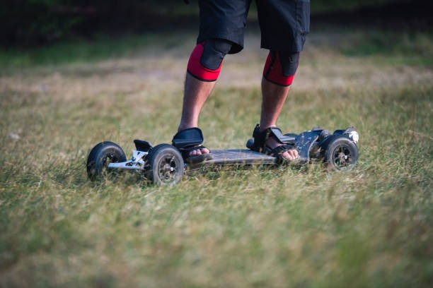 riding electric skateboard in grass