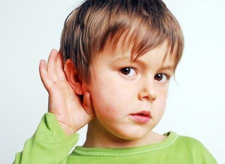 On Dr. Porro website, a boy puts his hand to his ear to improve his hearing or to listen carefully