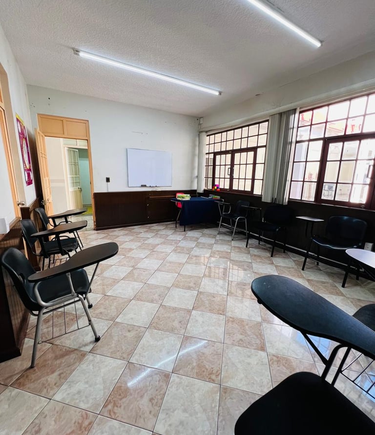 a room with chairs and tables and chairs
