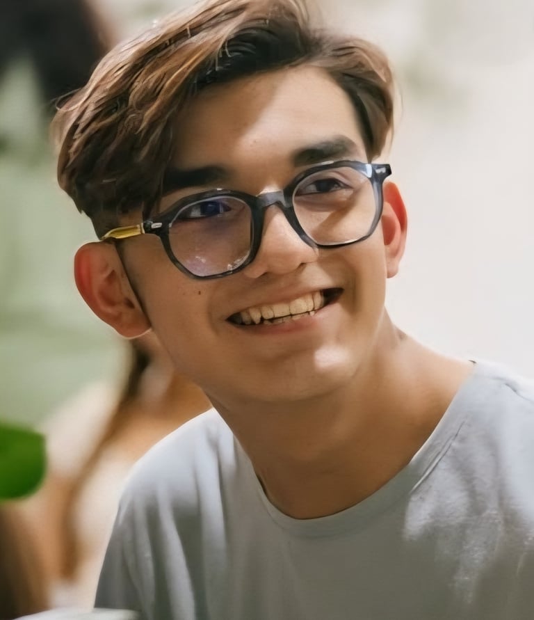 a young boy smiling 
