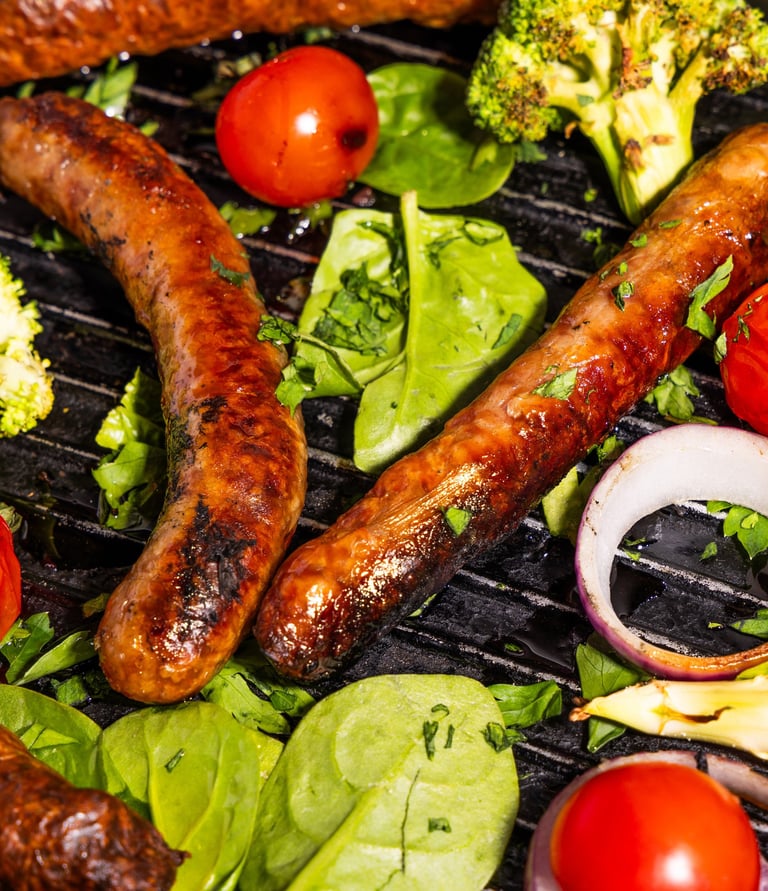Sustainable plant-based, nutritionally-dense, hypoallergenic protein and fibre sausages with vegetables surrounding