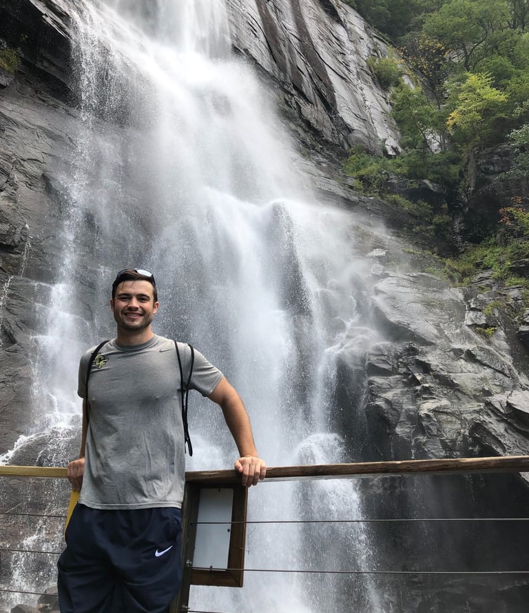 Travel physical therapist enjoying a waterfall on a weekend