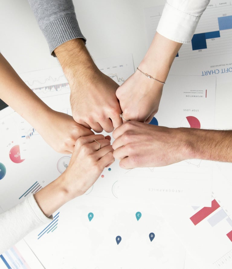 a group of people holding hands in a circle