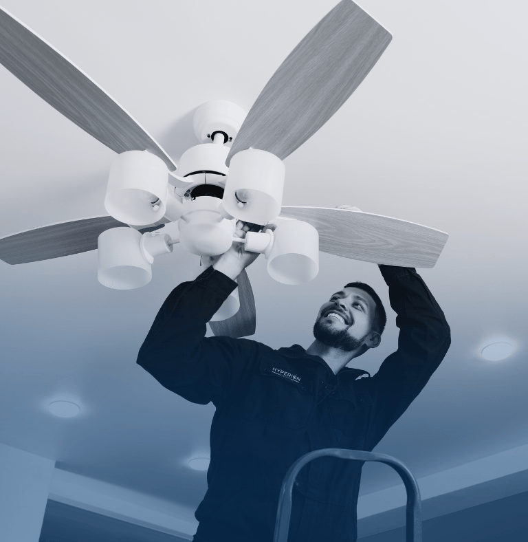 Hyperion electrician changing a fan at a customers house