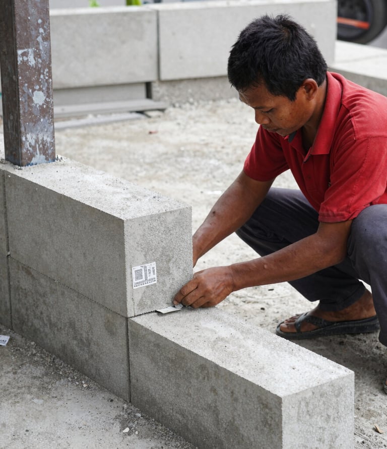 A skilled craftsman carefully working on a wooden frame in a modern home construction site.