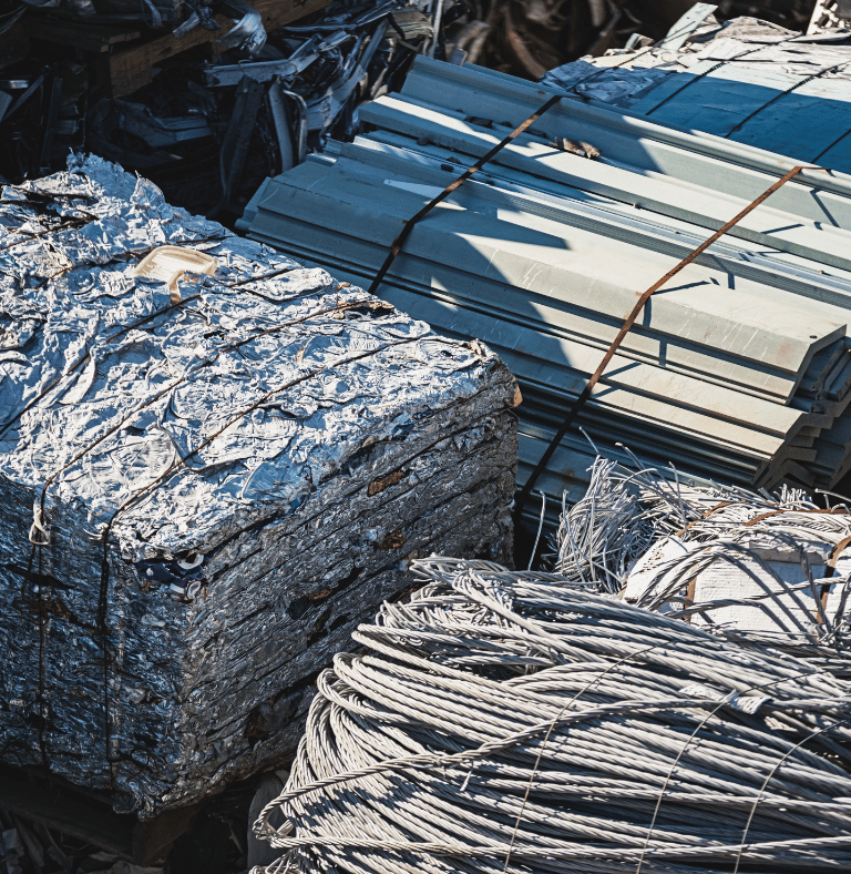 a pile of metal wire and aluminum sheets
