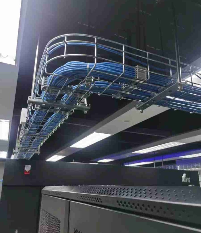 a rack of cables and cable tray in a server room