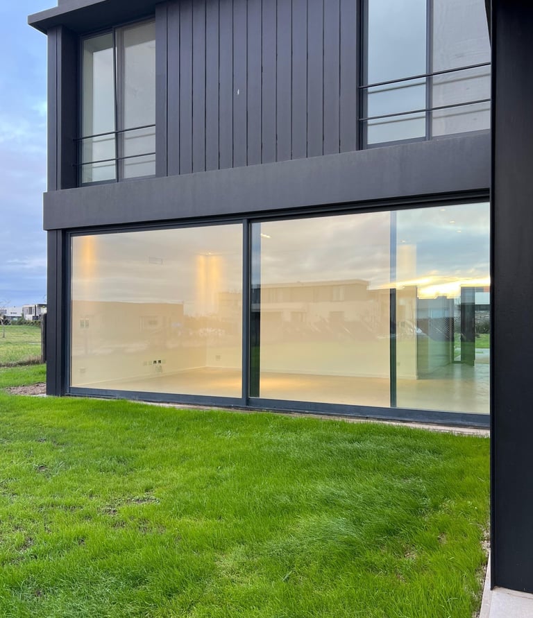 a large house with a large glass window