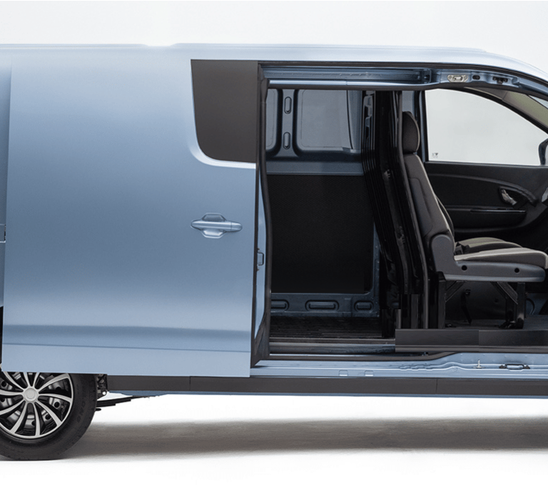 a blue van with a seat and a driver's seat