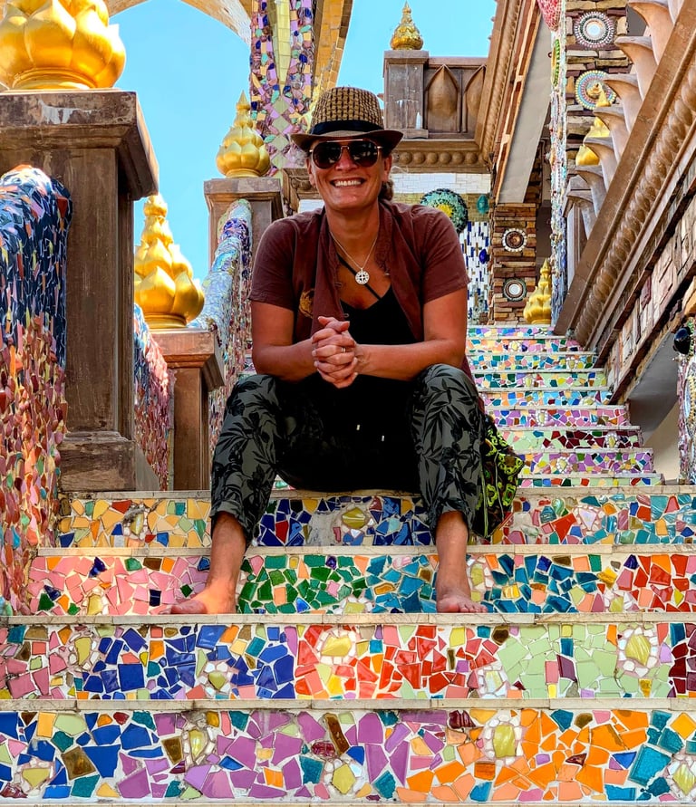 Erica surrounded by vibrant flowers and market colors, representing the creativity and personality b