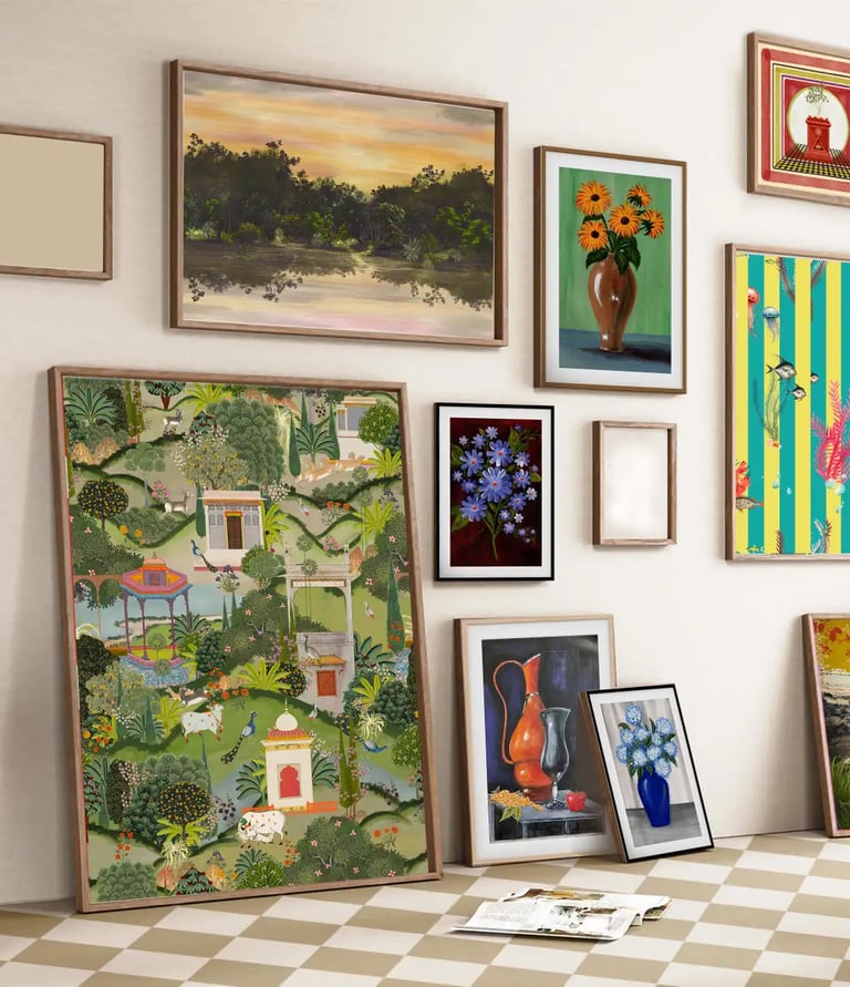 Eclectic gallery wall featuring framed botanical art, landscape paintings, and vibrant illustrations.
