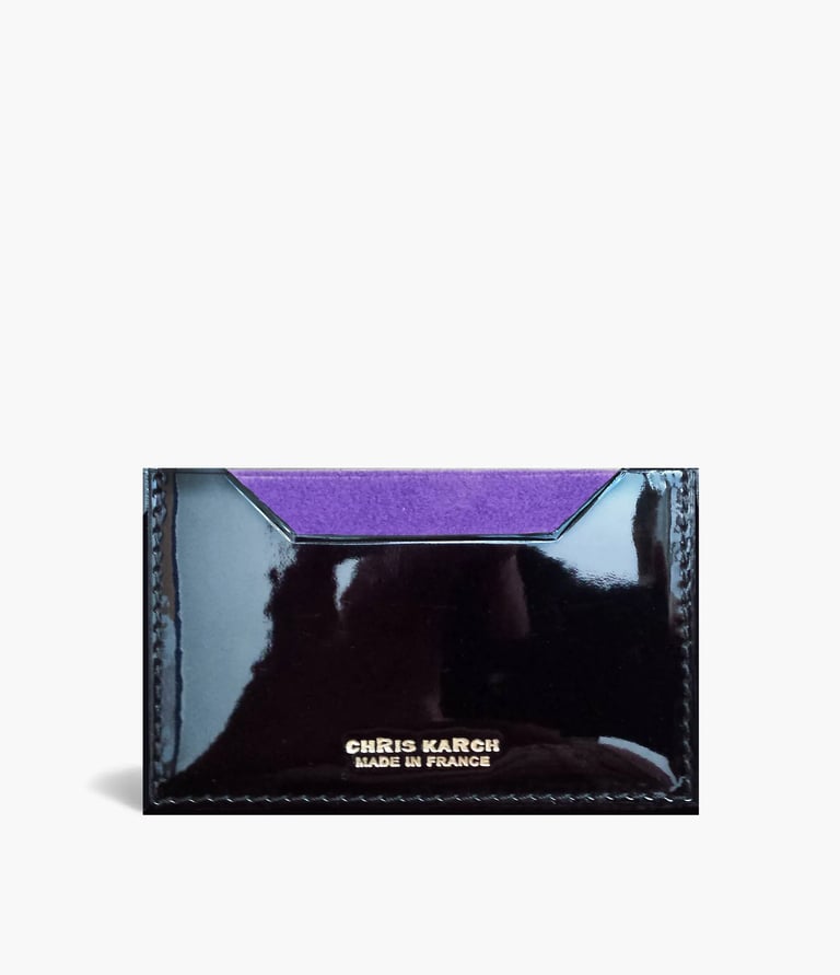 Elegant black patent leather card holder with a purple suede lining by Chris Karch.