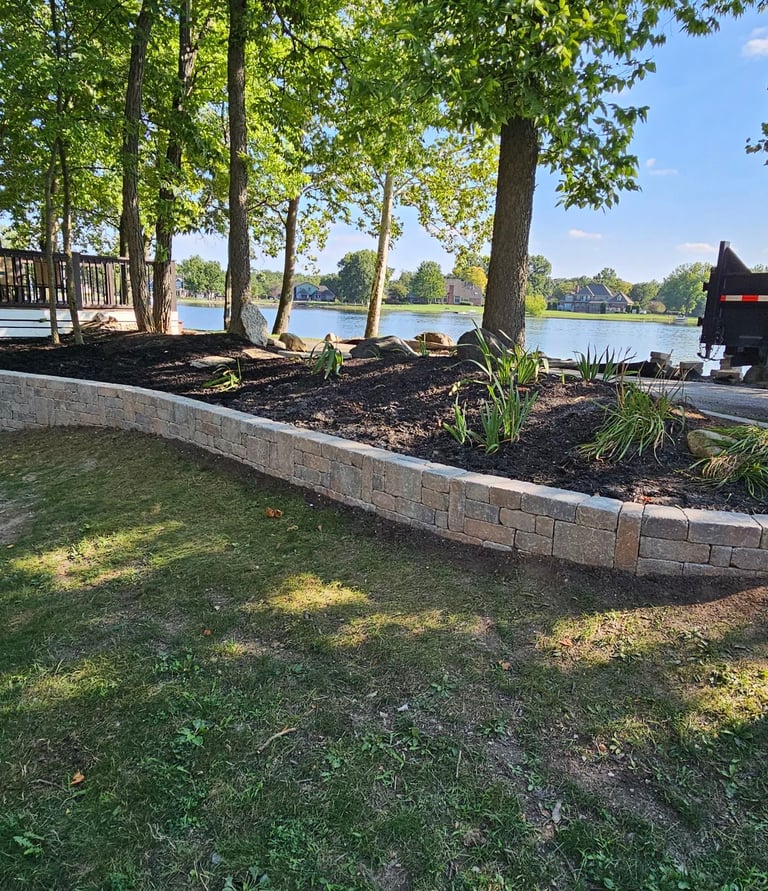 Custom retaning wall and landscaping along a lake