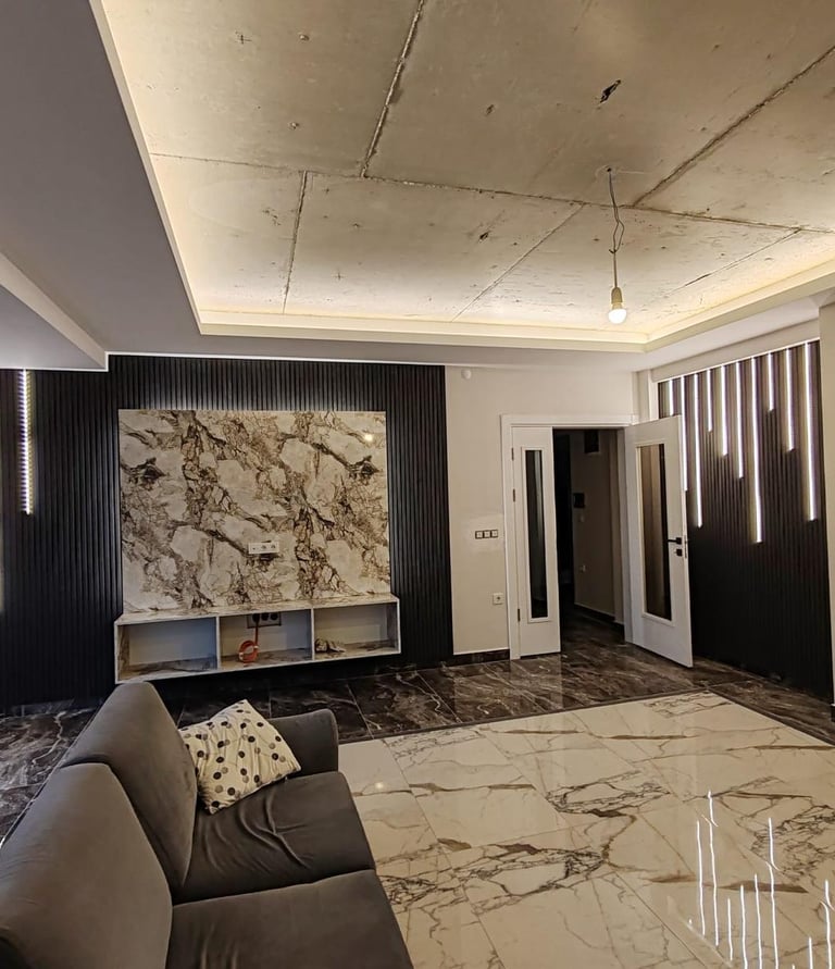 a living room with a couch and a large painting