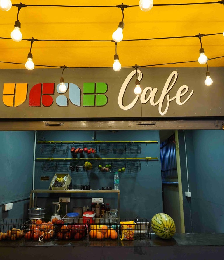 a storefront of a coffee shop with a yellow ceiling