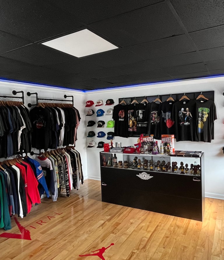 a vintage clothing store with a variety of clothing and accessories from sportswear band T-shirts, H