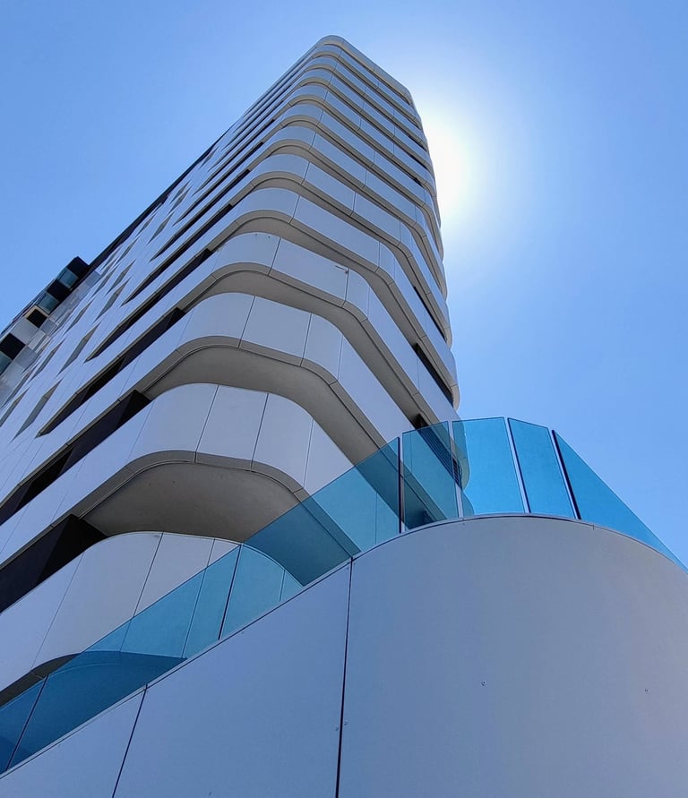 a tall building with a clock towering over a building