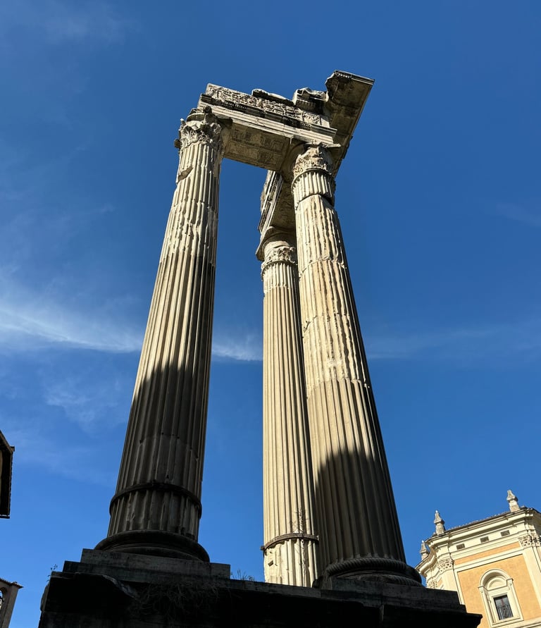 The ruined columns of the Temple of Saturn in Rome, Italy