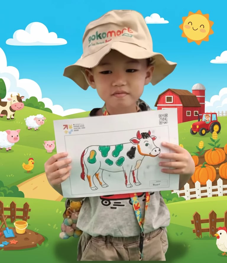 Child holding colored drawing template for Color to Life interactive game at kids event in Indonesia