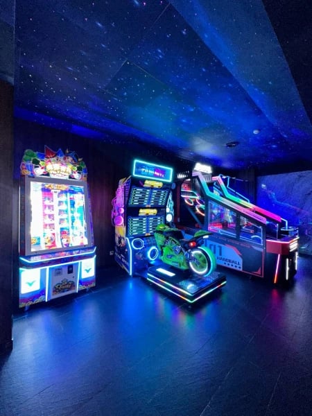 a game room with arcade machines and arcade machines