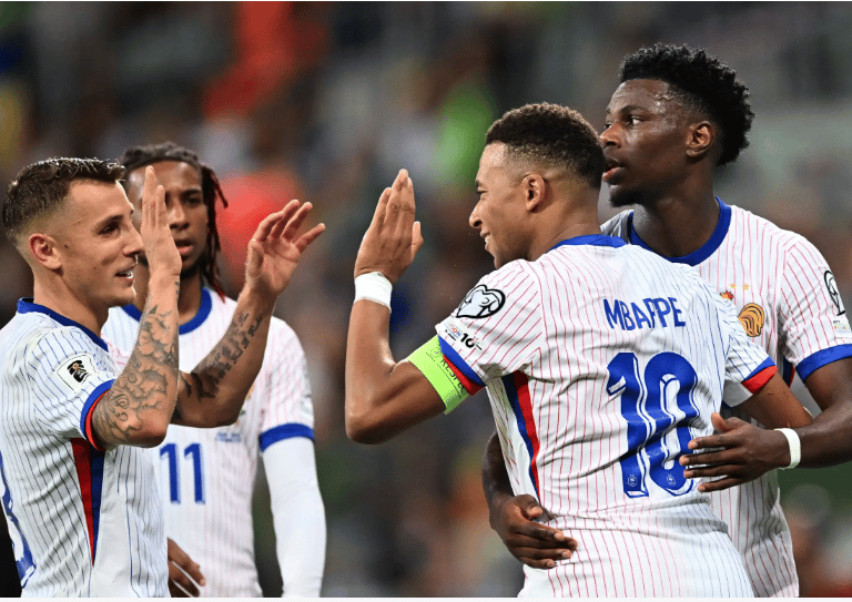a group of soccer players are congratched to each other