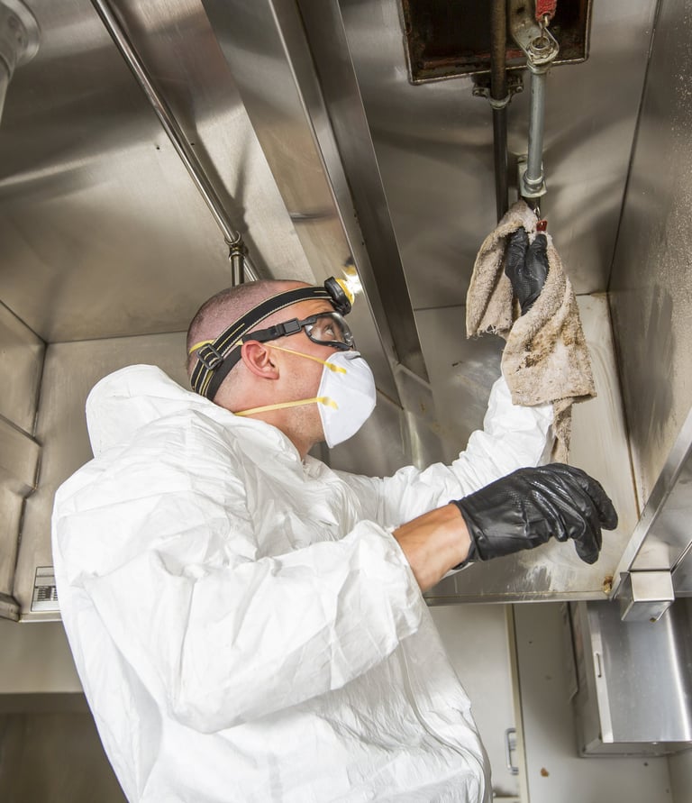 man cleaning kitchen