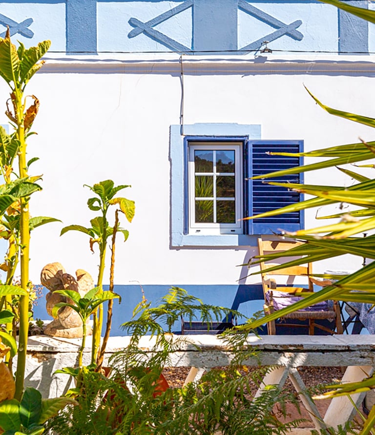 a house with a blue sky and a white house