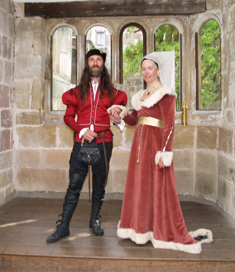 a man and woman in medieval costumes